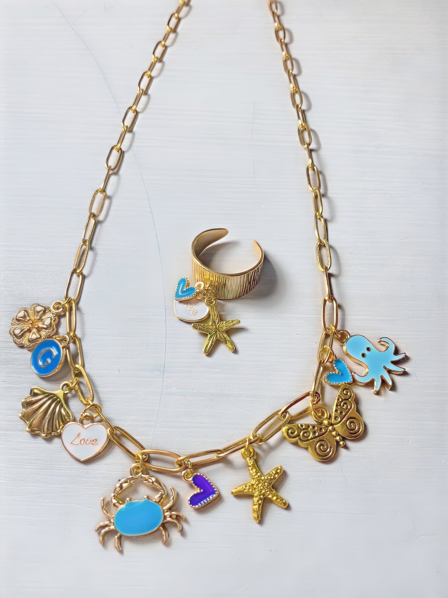 Collier breloque, bleu et doré, étoile de mer et bague assorti réglable acier, inoxydable